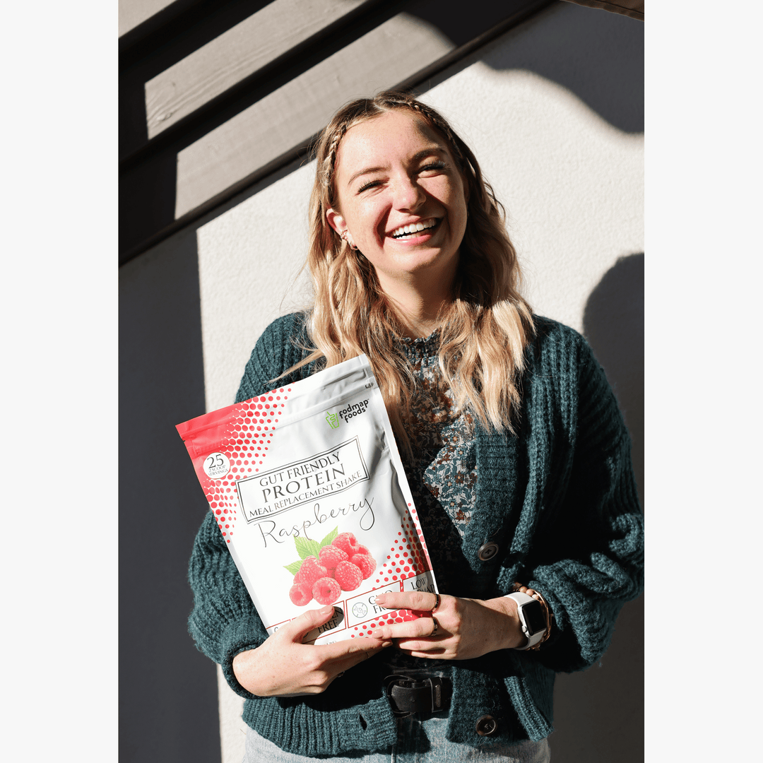 Delicous-looking-raspberry-meal-replacemt-shake-bag-held-by-an-youthfull-atractive-smiling-female